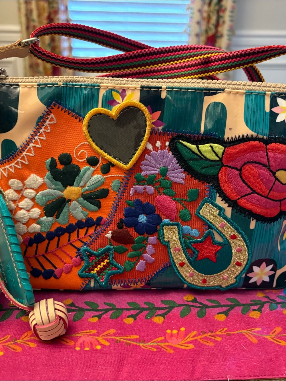 Consuela Dezi Midtown Teal & Orange Embroidered Crossbody Wristlet